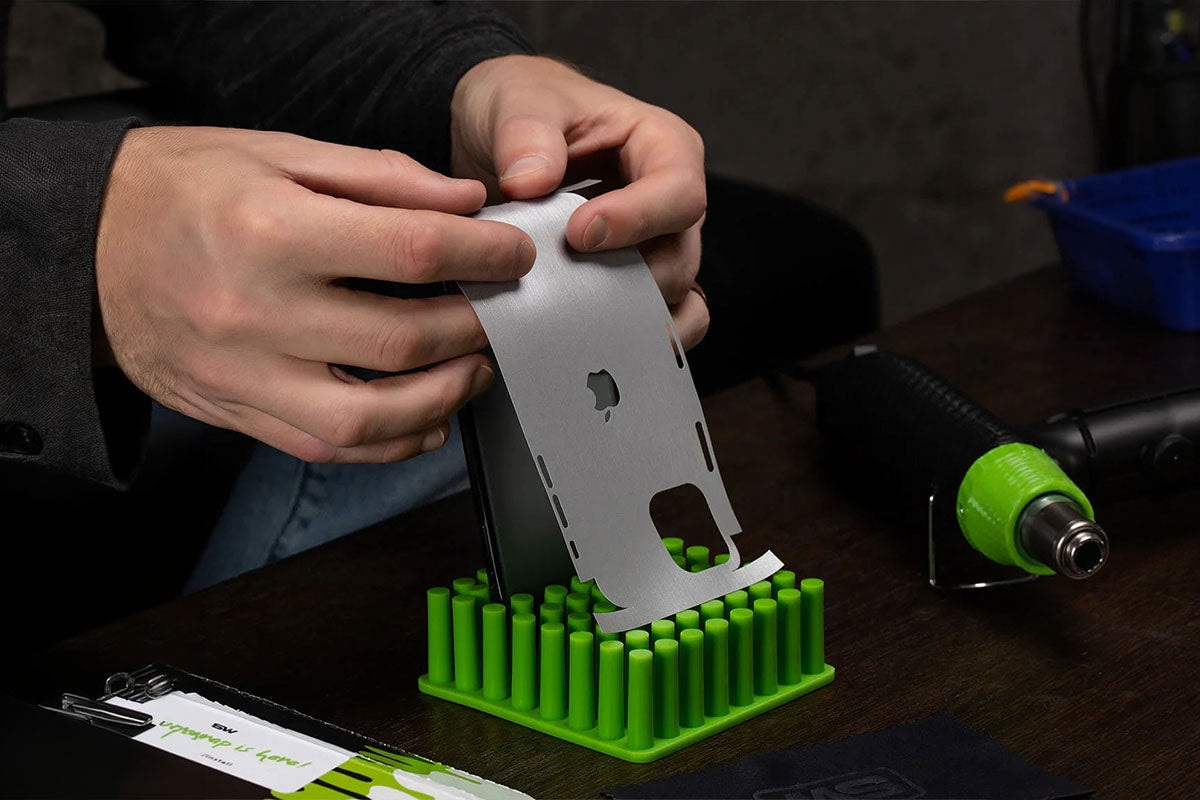 Applying a precision-cut skin to a phone