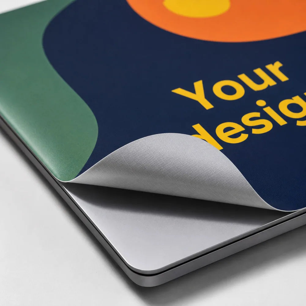 Close-up of a custom MacBook vinyl skin and adhesive backing