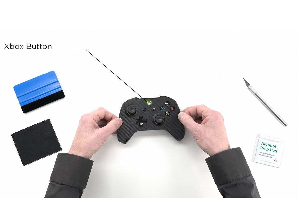 Applying a precision-cut skin to a gaming controller