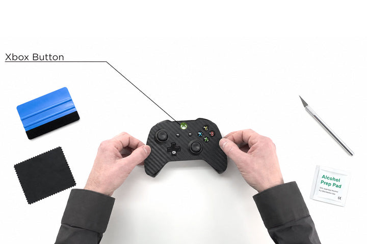 Applying a precision-cut skin to a gaming controller