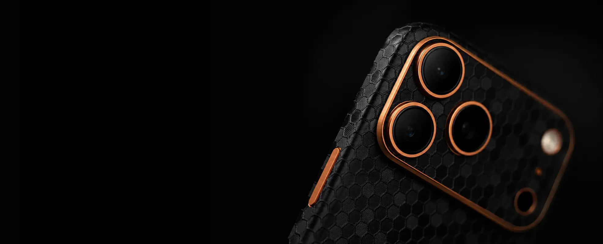 Black honeycomb phone skin with copper camera accents
