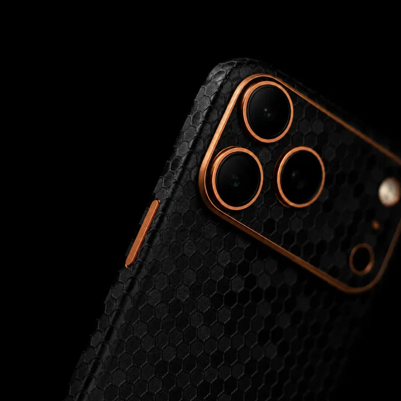 Black honeycomb phone skin with copper camera accents