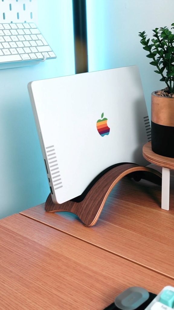 MacBook Pro with a silver retro Apple Slickwraps skin